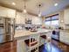 Bright kitchen featuring stainless steel appliances, white cabinets and granite countertops at 508 Summerfield Pl, Belmont, NC 28012