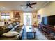 Open-concept living room with hardwood floors, a leather sofa and access to the kitchen at 508 Summerfield Pl, Belmont, NC 28012