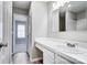 Bright bathroom featuring sleek fixtures and an entrance to bedroom at 6210 Windsor Gate Ln, Charlotte, NC 28215