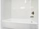 This bathroom features bright white tile in the bath area at 6210 Windsor Gate Ln, Charlotte, NC 28215