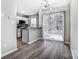 Stylish dining area with sliding door access to outdoor space and modern light fixture at 6210 Windsor Gate Ln, Charlotte, NC 28215