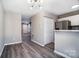 Open dining area features hardwood floors and flows into the modern kitchen space at 6210 Windsor Gate Ln, Charlotte, NC 28215