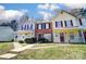 Attractive townhome exteriors with covered porches, tidy landscaping, and walkways at 6210 Windsor Gate Ln, Charlotte, NC 28215