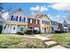 Inviting townhomes with well-manicured lawns, walkways, and charming covered front porches at 6210 Windsor Gate Ln, Charlotte, NC 28215