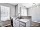 Kitchen featuring a stainless steel sink, updated cabinets, and lots of natural light at 6210 Windsor Gate Ln, Charlotte, NC 28215