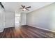 Hardwood floors, neutral paint colors, and ample natural light highlight the living room at 6210 Windsor Gate Ln, Charlotte, NC 28215