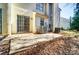 View of the back patio with sliding glass door access to home at 6210 Windsor Gate Ln, Charlotte, NC 28215