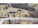 Expansive aerial view of property and land featuring road access and mature trees at 6285 Nc 16 N Hwy, Taylorsville, NC 28681