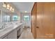 A bathroom equipped with dual sinks, closet and tiled walls at 6285 Nc 16 N Hwy, Taylorsville, NC 28681