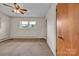 A bedroom with a window, a ceiling fan, and a spacious carpeted area at 6285 Nc 16 N Hwy, Taylorsville, NC 28681