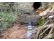 Natural creek flowing through property under large culvert with root system at 6285 Nc 16 N Hwy, Taylorsville, NC 28681