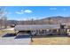 Beautiful single-story brick home with attached carport and classic front porch at 6285 Nc 16 N Hwy, Taylorsville, NC 28681