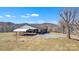 Single-story house featuring a carport with attached covered patio and mountain views at 6285 Nc 16 N Hwy, Taylorsville, NC 28681