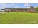 One-story brick house featuring a covered front porch and a lush green lawn at 6285 Nc 16 N Hwy, Taylorsville, NC 28681