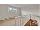 Upper landing provides a view of the room and access to staircase at 6285 Nc 16 N Hwy, Taylorsville, NC 28681
