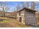 Weathered wooden outbuilding offers a glimpse of rural charm and potential at 6285 Nc 16 N Hwy, Taylorsville, NC 28681