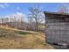 Rustic wooden outbuilding on a sunny hillside, evoking charm and functionality at 6285 Nc 16 N Hwy, Taylorsville, NC 28681