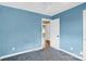 Bedroom with light blue walls, carpet flooring and ample closet space at 6308 Lake Forest E Rd, Charlotte, NC 28227