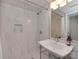 Modern bathroom features white marble tiled walk-in shower with chrome fixtures and a contemporary sink at 6319 Hazelton Dr, Charlotte, NC 28210