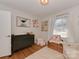 Bright Bedroom features a changing table, a window with natural light, and charming decor for a cozy space at 6319 Hazelton Dr, Charlotte, NC 28210