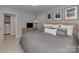Comfortable bedroom with a queen bed, soft pillows, and a dresser, adjacent to a laundry area at 6319 Hazelton Dr, Charlotte, NC 28210