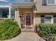 Charming home entrance with brick facade, manicured bushes, and decorative flower pots for a welcoming appeal at 6319 Hazelton Dr, Charlotte, NC 28210