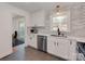 Open concept kitchen with stainless steel appliances and access to dining area at 6319 Hazelton Dr, Charlotte, NC 28210