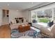 Cozy living room with large bay window and comfortable seating at 6319 Hazelton Dr, Charlotte, NC 28210