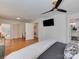Spacious main bedroom with hardwood floors and ensuite bathroom at 6319 Hazelton Dr, Charlotte, NC 28210