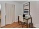 Modern office space with glass desk and rolling chair at 6319 Hazelton Dr, Charlotte, NC 28210