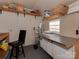 Functional workshop or storage space with shelving, work surfaces, and a window at 6319 Hazelton Dr, Charlotte, NC 28210