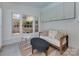 Bright sunroom featuring large windows, comfortable seating, and ample natural light for a relaxing space at 6319 Hazelton Dr, Charlotte, NC 28210