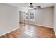 Bedroom with a ceiling fan, a closet with sliding mirror doors, and two bright windows at 6636 Rustic View Ct, Charlotte, NC 28216