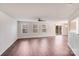 Bright living room featuring hardwood floors, neutral paint, and a sliding door for access to the patio at 6636 Rustic View Ct, Charlotte, NC 28216