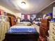 Well-used bedroom interior, filled with furniture and personal items at 701 N Scruggs St, Gastonia, NC 28052