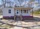 Charming single-story home featuring a covered porch and classic architectural details at 701 N Scruggs St, Gastonia, NC 28052