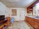 The kitchen is fully functional, with ample counter space, room for a table and an exit door at 701 N Scruggs St, Gastonia, NC 28052