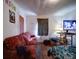 Modest room offering basic living space with vintage decor and flooring at 701 N Scruggs St, Gastonia, NC 28052