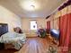 Cozy living room featuring hardwood floors and a window with a street view at 701 N Scruggs St, Gastonia, NC 28052