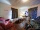 Compact room with furniture, lighting, and flooring that may benefit from renovation at 701 N Scruggs St, Gastonia, NC 28052