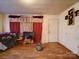 The living room has hardwood flooring and a television at 701 N Scruggs St, Gastonia, NC 28052