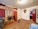 The living room has hardwood flooring and a television for entertaining at 701 N Scruggs St, Gastonia, NC 28052