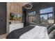 Modern bedroom with a city view, stylish furniture, and a sleek design with hardwood accents at 715 N Church St, Charlotte, NC 28202