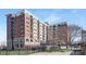 A stunning brick building, featuring multiple stories and beautiful balconies at 715 N Church St, Charlotte, NC 28202