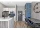 Modern kitchen featuring an island, dining table, stainless steel appliances, and pendant lighting at 715 N Church St, Charlotte, NC 28202