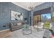 Stylish living room featuring a comfortable leather sofa, modern lighting, and a city view from the balcony at 715 N Church St, Charlotte, NC 28202
