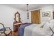 Charming bedroom featuring a beautiful antique mirror and rich, hardwood floors at 810 Bridgewood Dr, Rock Hill, SC 29732