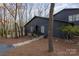 Charming home features a dark exterior and is surrounded by beautiful trees at 810 Bridgewood Dr, Rock Hill, SC 29732