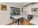 Kitchen nook featuring a breakfast table, window view, stainless steel appliances, and tile backsplash at 810 Bridgewood Dr, Rock Hill, SC 29732
