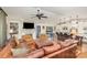 Open-concept living room featuring a fireplace and connecting to the kitchen with a central island at 810 Bridgewood Dr, Rock Hill, SC 29732
